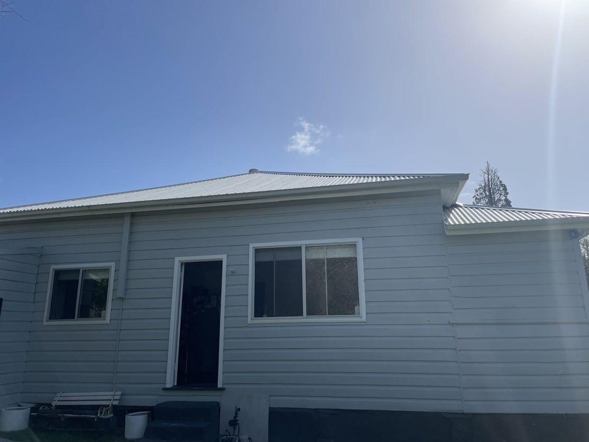 Finished exterior of a renovated weatherboard home